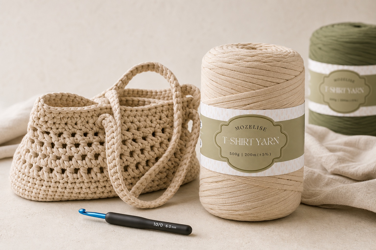 Mozelise T-shirt yarn beside a hand-crocheted cream tote and crochet hook